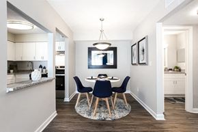 Marietta apartment for rent - A modern dining room with a round table and chairs at Barcelo at East Cobb Apartments, Marietta, GA