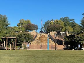 Norcross apartment for rent - A park with a gazebo, steps, and a flag.at Waverly Manor Townhomes, Norcross, GA 30071