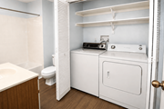 Kansas City townhouse for rent - A white laundry room with a washer and dryer.