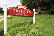 Mission apartment for rent - A red sign with white lettering that says "Bridges" on it.