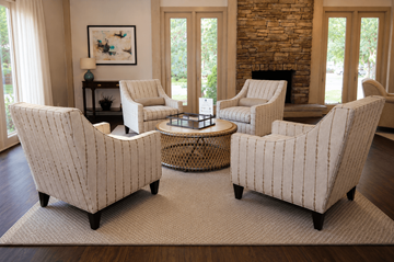 Overland Park townhouse for rent - Four chairs are arranged around a coffee table in a room with a stone fireplace.