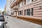 San Francisco townhouse for rent - a street view of a building with a sidewalk and a parking meter