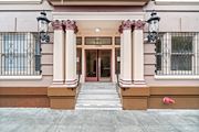 San Francisco townhouse for rent - the front of a building with a red door and columns