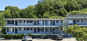 San Rafael apartment for rent - A car is parked in front of a two-story apartment building.