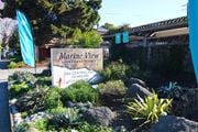 Alameda apartment for rent - A sign for Marine View Apartment Homes is in front of a fence.