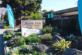 Alameda apartment for rent - A sign for Marine View Apartment Homes is in front of a fence.