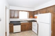 Kansas City townhouse for rent - Tile floor kitchen at Canyon Creek Apartments, Kansas City, 64132