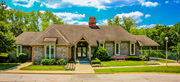 Kansas City townhouse for rent - a small brick house with a bench in front of it