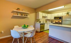 Hillsboro apartment for rent - a kitchen with a white table and chairs