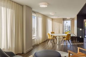 Bronx apartment for rent - a dining room with a table and chairs and a large window