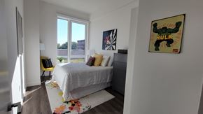Bronx apartment for rent - a bedroom with a bed and a large window