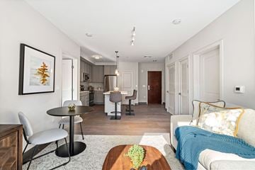 Brockton apartment for rent - A modern living room with a dining table and chairs.