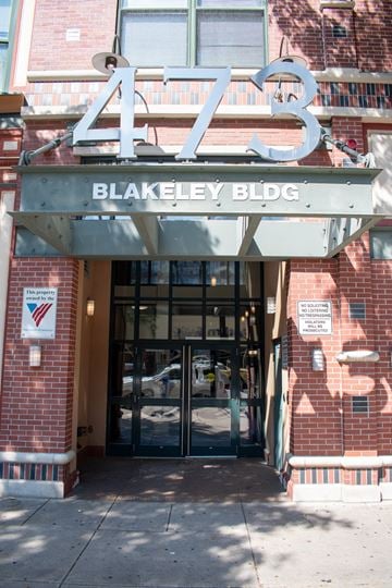 Lawrence apartment for rent - The Blakeley Building is a red brick building with a large number 473 on top.