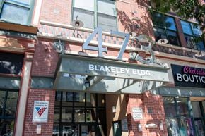Lawrence apartment for rent - A sign for Blakeley Bldg is displayed above a Chelsleti Boutique.