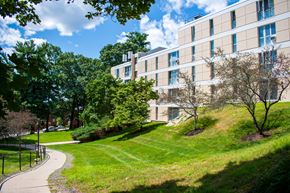 Marlborough apartment for rent - a large building on a grassy hill with trees