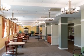 Mattapan apartment for rent - a dining room with chandeliers and tables and chairs