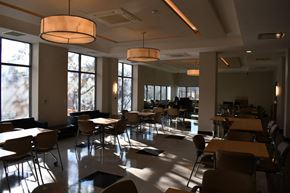 Bronx apartment for rent - a dining room with tables and chairs and large windows