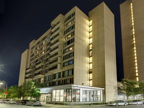 Boston apartment for rent - a night view of an apartment building on a city street