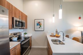 Worcester apartment for rent - a kitchen with stainless steel appliances and a white counter top