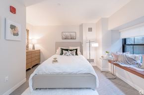 Worcester apartment for rent - a bedroom with a bed and a dresser and a window