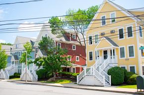 Dorchester townhouse for rent - a row of colorful houses on a street