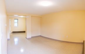 Roxbury apartment for rent - an empty room with yellow walls and white trim