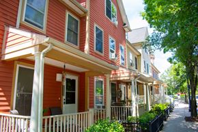 Dorchester townhouse for rent - a row of red houses with white porches