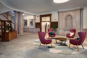 Worcester apartment for rent - a lobby of a building with chairs and a table