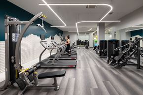 Worcester apartment for rent - a group of people working out in a gym with cardio equipment