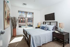 Brockton apartment for rent - a bedroom with a large bed and a window