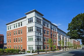 Brockton apartment for rent - A street view of a row of apartment buildings.
