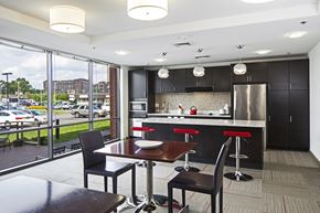 Brockton apartment for rent - a kitchen and dining room with a view of a parking lot