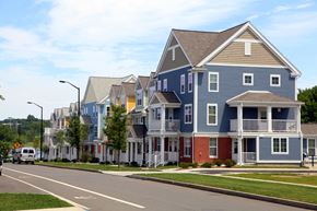 New Haven apartment for rent - a row of colorful homes on the side of a street