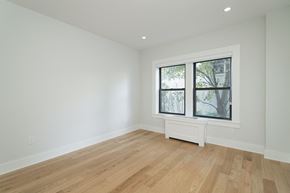 Somerville apartment for rent - a living room with white walls and a large window