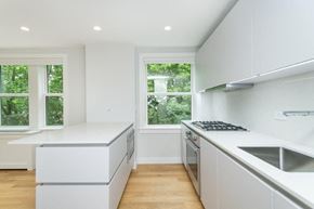 Somerville apartment for rent - a white kitchen with a stove and a window