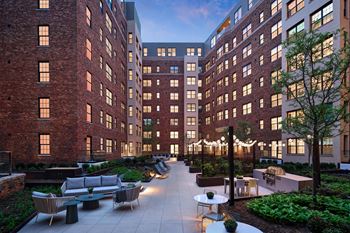 Landscaped courtyard with grills and lounge areas