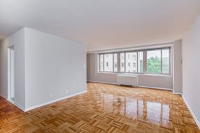 Washington apartment for rent - an empty living room with wood flooring and a window