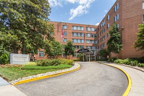 Washington apartment for rent - A building with a flag on it and a sign that says Questar.