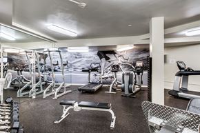 Washington apartment for rent - A gym with a variety of equipment including weights and cardio machines.
