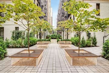 Manhattan apartment for rent - A courtyard with benches and trees.