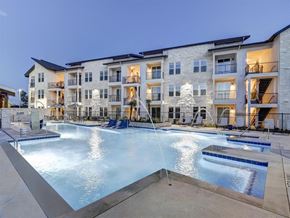 Leander apartment for rent - a swimming pool with an apartment building in the background
