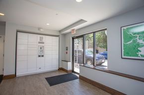 Boston apartment for rent - a lobby with a white door and a window with a car parked outside