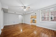 Philadelphia apartment for rent - A room with wooden floors and a ceiling fan.