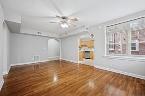 Philadelphia apartment for rent - A room with wooden floors and a ceiling fan.