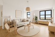 King Of Prussia apartment for rent - A living room with a white couch, a wooden chair, a round table, and a large window.