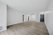 Philadelphia apartment for rent - A room with a wooden floor and white walls.