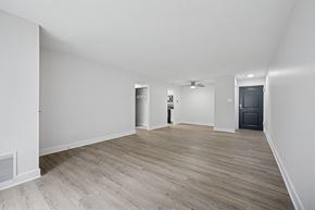 Philadelphia apartment for rent - A room with a wooden floor and white walls.