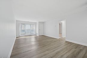 Philadelphia apartment for rent - A room with wooden flooring and white walls.
