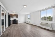 Philadelphia apartment for rent - A spacious room with wooden flooring and large windows.