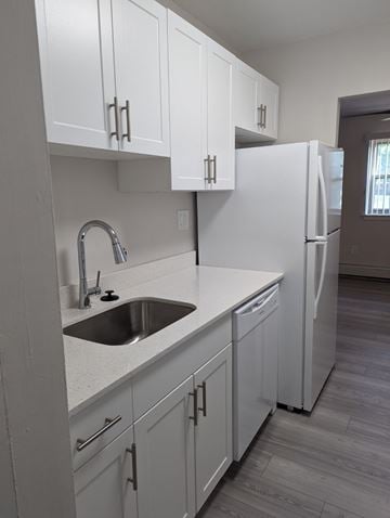 Philadelphia apartment for rent - A kitchen with white cabinets and a white refrigerator.